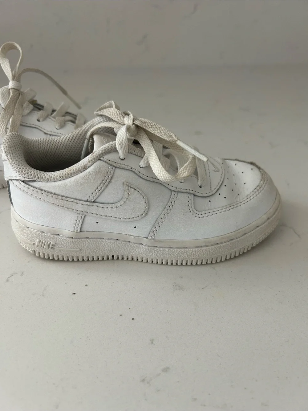Nike Kids White Low-Top Sneakers with Classic Swoosh